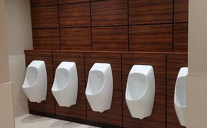 Hotel with waterless urinals